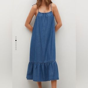 Super cute oversized denim dress with frilled bottom. Adjustable straps